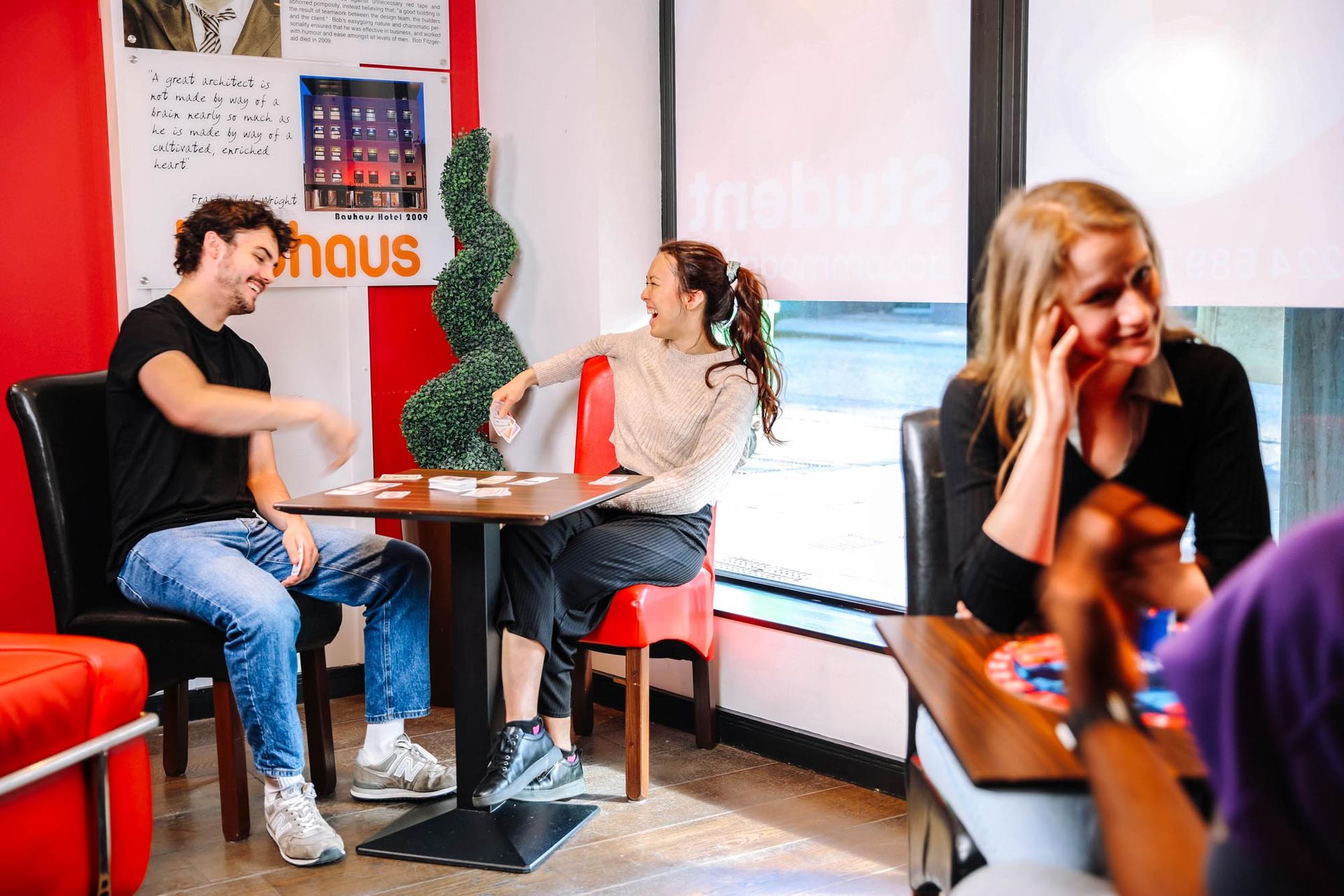 Students playing games in their student accommodation communal area